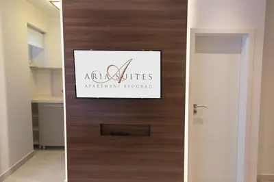 a door in a room with a sign on it at Aria Royal Nusic apartment in Belgrade