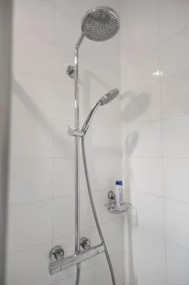 a shower with a shower head in a bathroom at Aria Royal Nusic apartment in Belgrade
