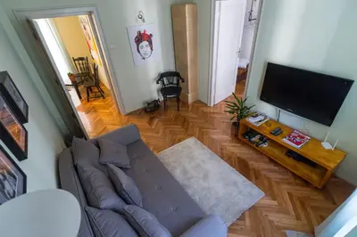 a living room with a couch and a flat screen tv at Apartment Vivian in Belgrade