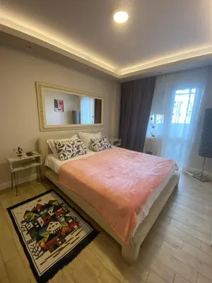 a bedroom with a large bed and a window at Apartman Skadarlija in Belgrade