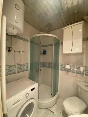 a bathroom with a shower and a toilet and a sink at Apartman Skadarlija in Belgrade