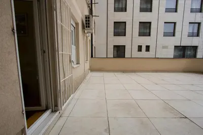 an empty hallway with a building in the background at Lux Life Apartment in Belgrade