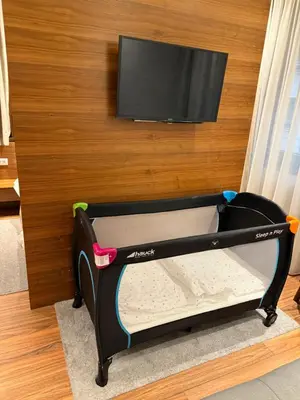 a pretend bed with a flat screen tv on a wall at NV Luxury Suites & Spa in Belgrade