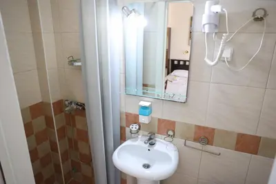 a bathroom with a sink and a mirror at Marex Centar in Jabuka