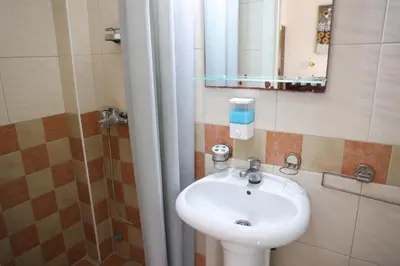 a bathroom with a sink and a mirror at Marex Centar in Jabuka