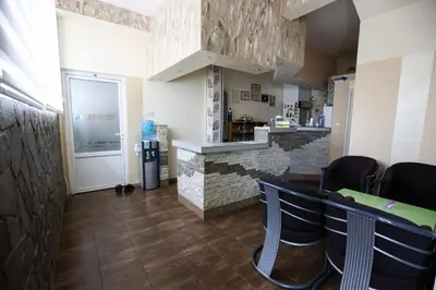 a bar in a restaurant with chairs and a counter at Marex Centar in Jabuka