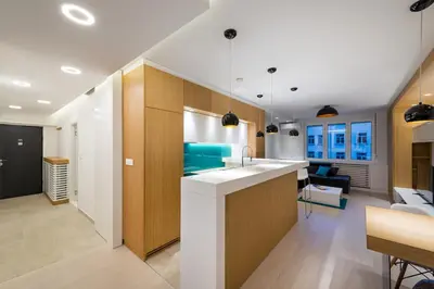a kitchen and living room with a sink and a counter at Vivio Luxury Apartment in Belgrade