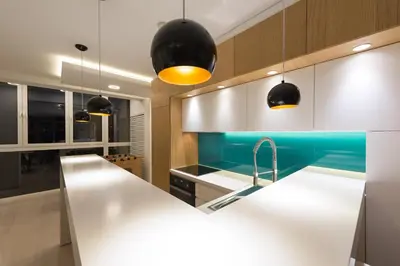 a kitchen with a white counter and a sink at Vivio Luxury Apartment in Belgrade