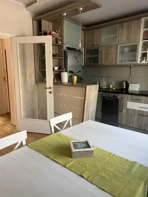 a kitchen with a table with a plate on it at Orchid House in Belgrade