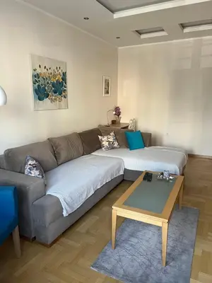 a living room with a couch and a coffee table at Orchid House in Belgrade