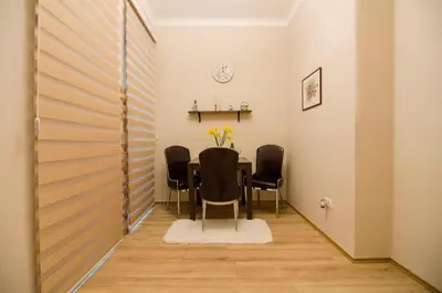 a dining room with a table and chairs at Villa Rose in Belgrade