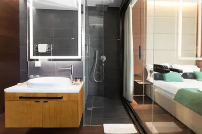a bathroom with a sink and a shower at Dominic Smart & Luxury Suites - Parliament in Belgrade