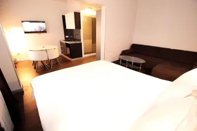 a living room with a couch and a table at Passion Downtown Suite in Belgrade