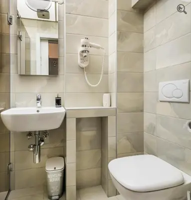 a small bathroom with a toilet and a sink at Passion Downtown Suite in Belgrade