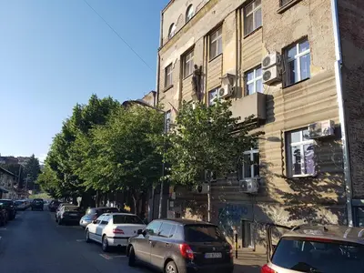 a street with cars parked on the side of a building at Passion Downtown Suite in Belgrade