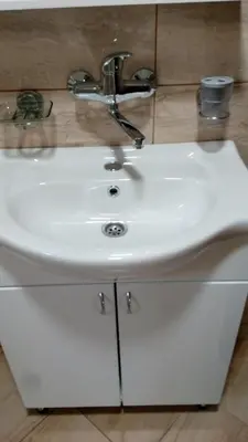 a bathroom sink with a faucet on top of it at Djurdja Apartment in Arandjelovac