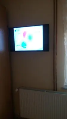 a flat screen tv on the wall of a room at Djurdja Apartment in Arandjelovac