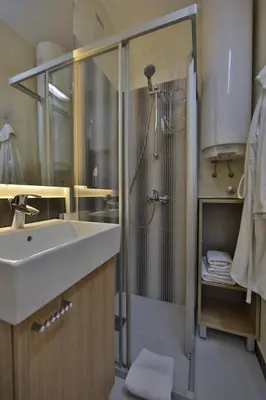 a bathroom with a sink and a shower at Apartment Alek in Belgrade
