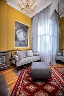 a living room with a couch and a window at Ben Akiba Luxury Suites in Belgrade
