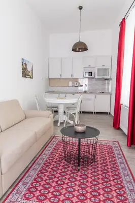 a living room with a couch and a table at Apartment Savamala 59 in Belgrade