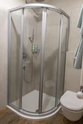 a shower stall in a bathroom with a toilet at Apartment Savamala 59 in Belgrade