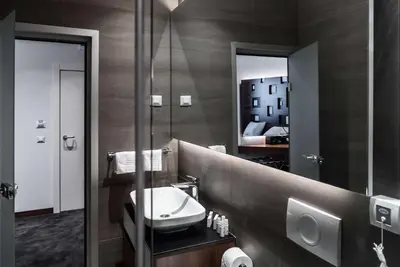a bathroom with a sink and a mirror at Best Western Premier Natalija Residence in Belgrade
