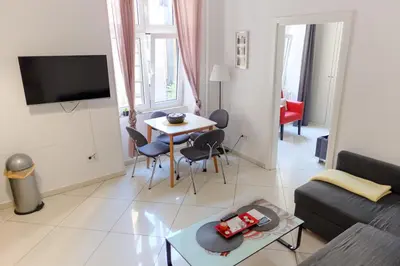 a living room with a couch and a table at Apartment Luna Terazije in Belgrade