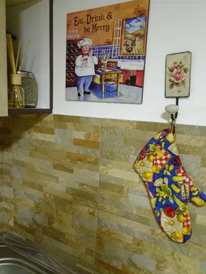 a painting on the wall of a kitchen at Meda Apartment in Belgrade