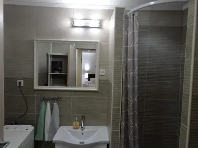 a bathroom with a sink and a shower at Meda Apartment in Belgrade