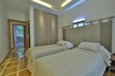 a room with two beds in a room at Aber Apartment in Belgrade