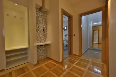 a hallway of a home with a walk in closet at Aber Apartment in Belgrade