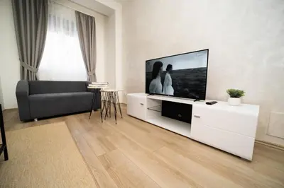 a living room with a large flat screen tv at Ring Inn Apartments in Obrenovac