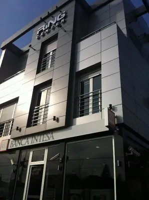 a building with a sign on the front of it at Ring Inn Apartments in Obrenovac