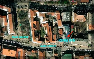 a map of a city with a red arrow at Ring Inn Apartments in Obrenovac