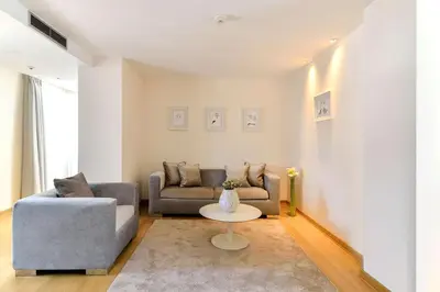 a living room with a couch and a table at Belgrade Art Hotel, a member of Radisson Individuals in Belgrade
