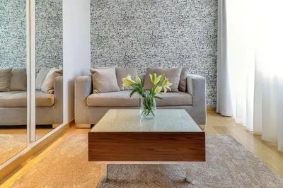 a living room with a couch and a coffee table at Belgrade Art Hotel, a member of Radisson Individuals in Belgrade