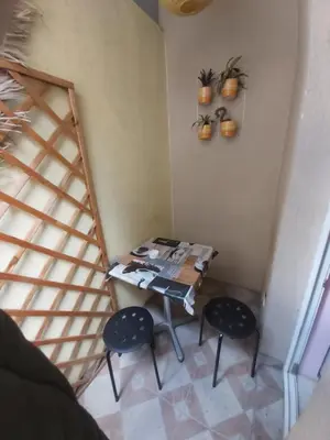 a small table and two chairs in a room at Keti 1 in Belgrade