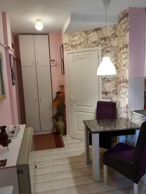 a kitchen with a table and a dining room at Keti 1 in Belgrade