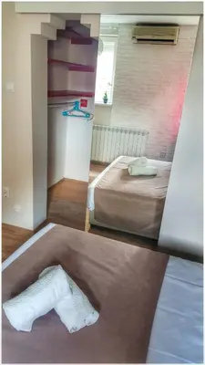 two pictures of a room with a bed and a towel at Apartment Cherry Queen in Belgrade