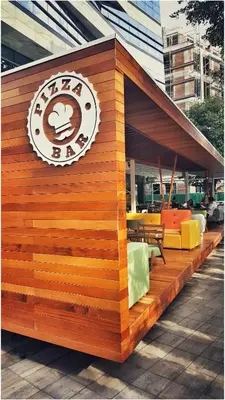 a restaurant with a sign on the side of it at Apartment Cherry Queen in Belgrade