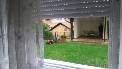 a view from a window of a backyard with a yard at Apartment Aqua Royal in Arandjelovac