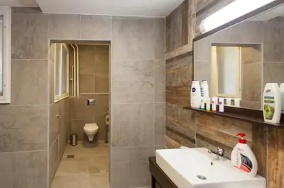 a bathroom with a sink and a toilet at Chess Apartments in Belgrade