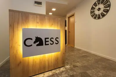 a hallway with a ciss sign on a wall at Chess Apartments in Belgrade