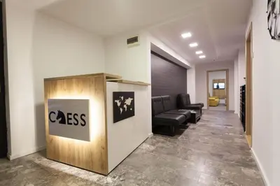 a lobby with a class sign on a wall at Chess Apartments in Belgrade