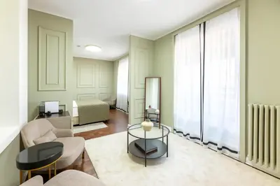 a living room with a couch and a table at Hotel Majestic in Belgrade