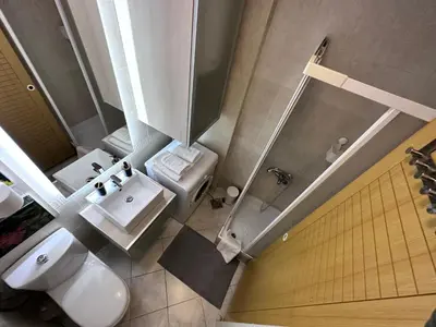 an overhead view of a bathroom with a toilet and sink at BASE Accommodation Apartments in Belgrade