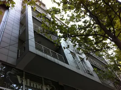 a tall building with balconies on the side of it at BASE Accommodation Apartments in Belgrade