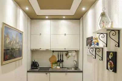 a kitchen with white cabinets and a sink at Apartment D-22 in Belgrade