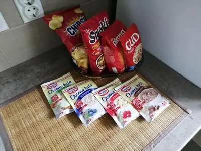 three bags of food sitting on a kitchen counter at Airport apartment T&T in Surčin