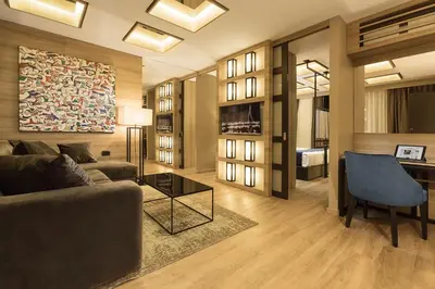 a living room with a couch and a table at Eden Luxury Suites Terazije in Belgrade